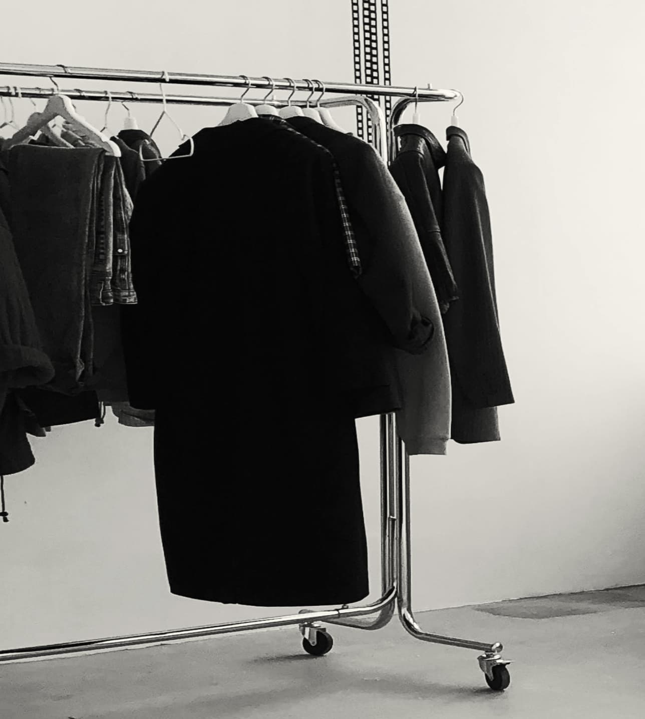 A clothing rack full of returned garments.